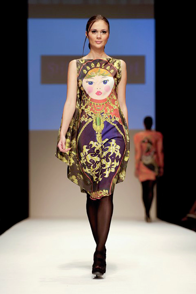 short silk dress cut in bias showed dubai fashion week of Russian matryoshka print.