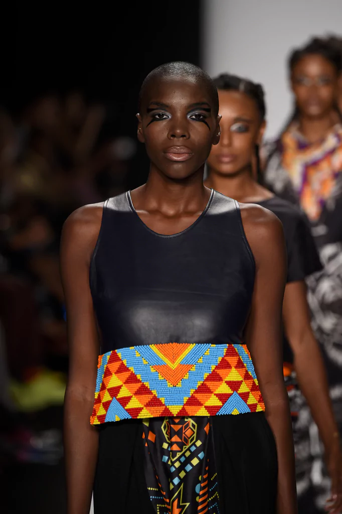 Beaded leather tank top with a geometric tribal printed long skirt worn by a model shown in the runway of mercedes benz new york fashion week