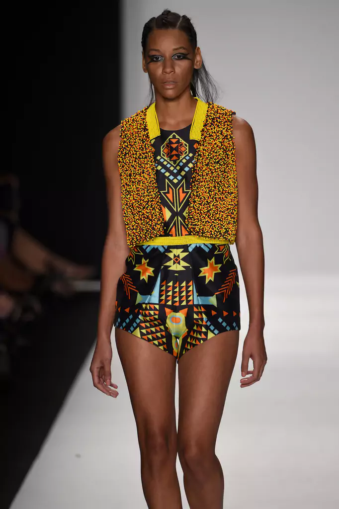 SHREKAHNTH — HOME 2026 16 Hand-beaded bolero jacket with glass beaded waist embroidery, geometric tribal prints and patterns on playsuit, worn by model on runway at Mercedes-Benz New York Fashion Week