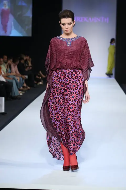 SHREKAHNTH — HOME 2026 11 Classic kaftan with black and pink keffiyeh print top, gathered waist, Islamic art in black, pink, and blue, and geometric neckline with crystal embellishments.