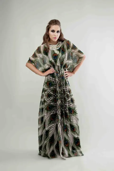 SHREKAHNTH — HOME 2026 13 Classic designer kaftan of modest fashion in light pink crinkle silk chiffon with Indian peacock feather print, shirred from underbust to waist, 3D jewelry neckline, and real peacock feathers.