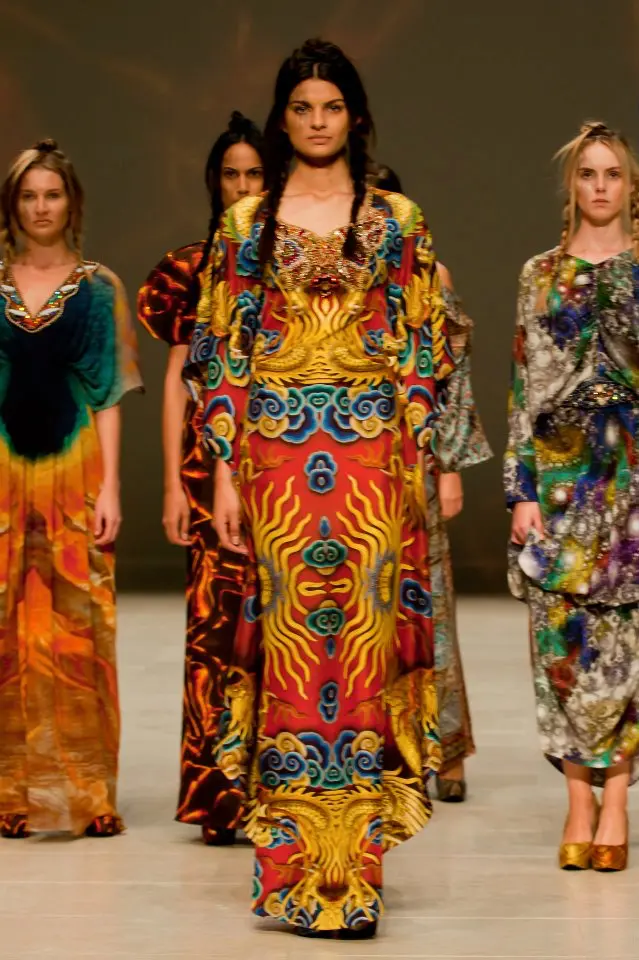 Chinese Dragon print kaftan shown at the center of the stage at the end of the show, other models out of frame.