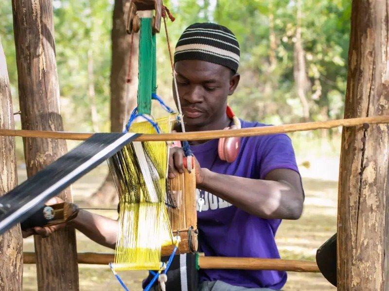 SHREKAHNTH — HOME 2026 7 Daboya weaver working at a traditional loom in Ghana