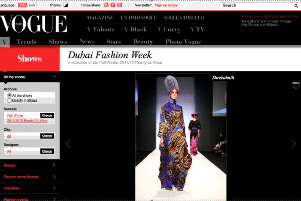 Model in a floor-length graphic kaftan with headwrap by Shrekahnth at Dubai Fashion Week Fall/Winter 2011/12, published on Vogue Italia.
